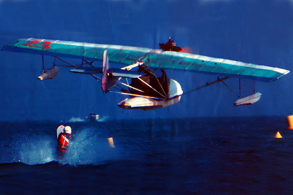 Mat experimenting on the water behind a plane